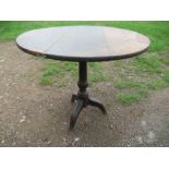 An oak tripod table, diameter 18ins