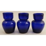 A set of three late 18th century Georgian Bristol blue glass hyacinth bulb vases.