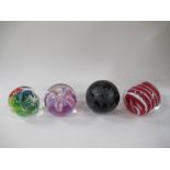 A collection of glass paperweights, together with glass model animals
