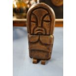 A carved wooden erotic figure