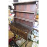 An oak dresser, width 43ins height 65ins