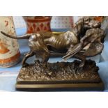 A bronze effect model of a gun dog carrying a pheasant