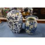 A modern covered Oriental blue and white jar, together with another modern Oriental vase