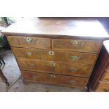 A 18th century design walnut chest of drawers, having two short drawers over three long drawers,