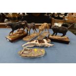 Albany Fine China, four porcelain models of dogs and one of a cat