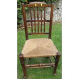 A Lancashire chair, with spindle back and caned seat