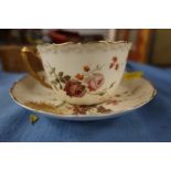 A Royal Worcester blush ivory cup and saucer