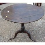 An 19th century oak tripod table, diameter 30.5ins, height 26ins