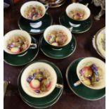 Six Aynsley cabinet cups and saucers, the interiors of the cups decorated with fruit, and two