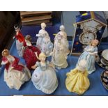 Nine Royal Worcester figurines, together with a Royal Worcester Millennium clock