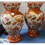 A pair of Japanese Katuni vases, decorated with birds and flowers, height 12ins