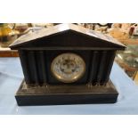 A Victorian black slate mantel clock, of architectural form