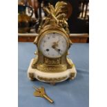 A gilt metal and marble mantel clock, with striking movement