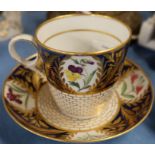 A 19th century English porcelain cup and saucer, decorated with flowers - The cup are saucer have no