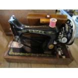 A Singer sewing machine, in wooden case