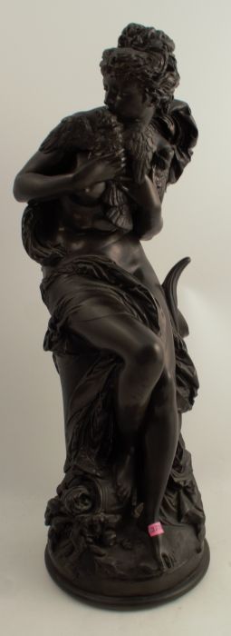 After Carrier-Belleuse, a bronzed resin model of a classical female clutching two birds, height