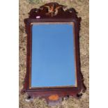 An antique mahogany fret cut wall mirror, decorated with hoho bird, overall size 29.5ins x 16ins