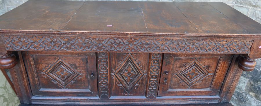 An antique oak court cupboard, fitted with two cupboards to the upper section, and a central - Image 2 of 5