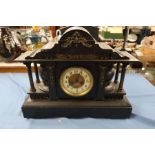 A Victorian black slate mantel clock, of architectural form