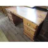 A modern pine desk, width 58ins, depth 24ins, height 29.5ins