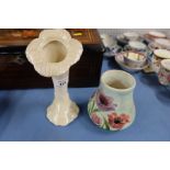 A Belleek vase, formed as a flower, together with a Radford vase, decorated with flowers