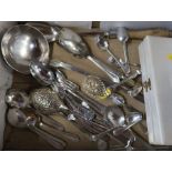 A collection of flatware to include some hallmarked silver tea spoons