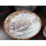 An Oriental bowl, decorated with a snowy landscape with Satsuma palette border, character marks to