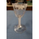 An Antique cordial glass, with air twist stem and vine decoration to the bowl
