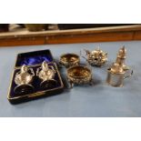 A collection of hallmarked silver condiments, to include a cased pair of pepper pots, two covered