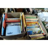 A collection of annuals, books etc