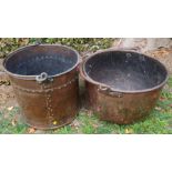 Two copper buckets, with swing handles, one with stud decoration