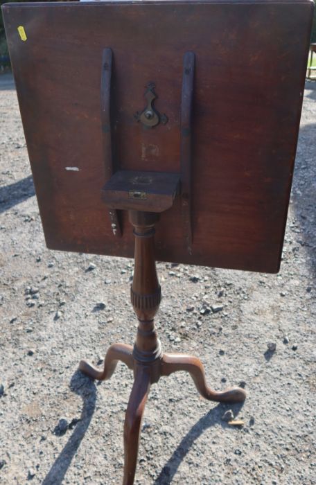 A 19th century mahogany square tilt top table, raised on a turned column and three outswept - Image 3 of 3