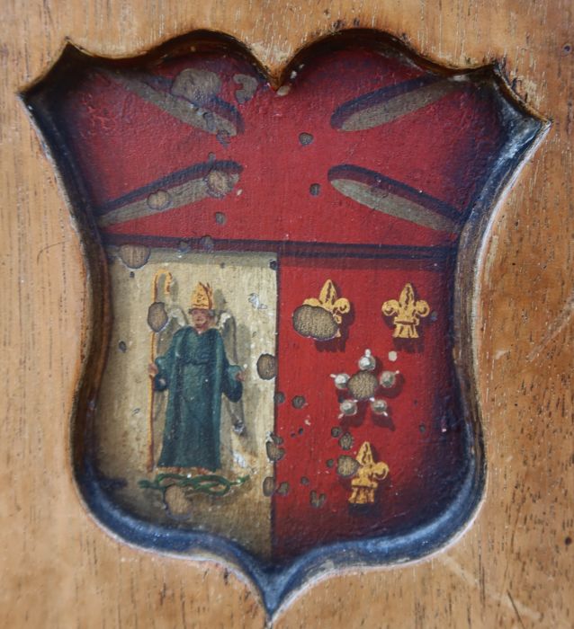 A 19th century mahogany armorial hall chair, the carved back painted with an armorial, with solid - Image 2 of 4