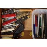 A box of penknives, pens
