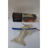 A boxed Penguin 16" Ocean racer, together with a Jaques London four player croquet set and a boxed