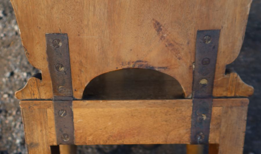 A 19th century mahogany armorial hall chair, the carved back painted with an armorial, with solid - Image 4 of 4