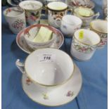 A collection of 19th and 20th century tea cups and coffee cans, two with saucers, some with cross