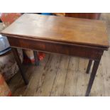 A 19th century mahogany fold over tea table, of rectangular form, fitted with a drawer, 32ins x
