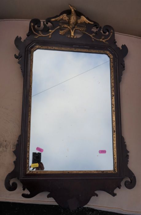 A Georgian design fret cut wall mirror, decorated with a gilded Ho-Ho bird, overall 31ins x 17.5ins,
