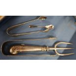 A silver handled toasting fork, together with two pairs of sugar tongs and a condiment spoons