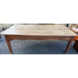 An antique oak farmhouse kitchen table, the three plank top raised on square legs, 85ins x 44ins,