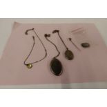 Three lockets, a stick pin, coins etc