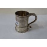 A silver pint tankard, with ribbed decoration, inscription to base, London 1932, weight 15oz, height