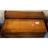 A 19th century mahogany lap desk, with tamber roll top section opening with the drawer, fitted