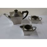 A Warric pewter three piece tea set, together with various glasses and a tin