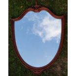 A shield shaped wall mirror, with urn decoration, overall height 38ins