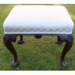 A Georgian design mahogany stool, with upholstered top, carved decoration to the cabriole legs,
