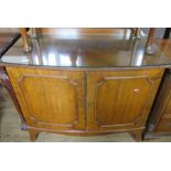 A mahogany bow fronted cabinet, width 39ins, height 29ins
