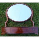 A 19th century mahogany dressing table mirror, the oval mirror raised on shaped supports, the bow