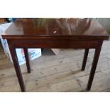 A 19th century mahogany fold over card table, of rectangular form, 34ins x 17ins, height 29ins,
